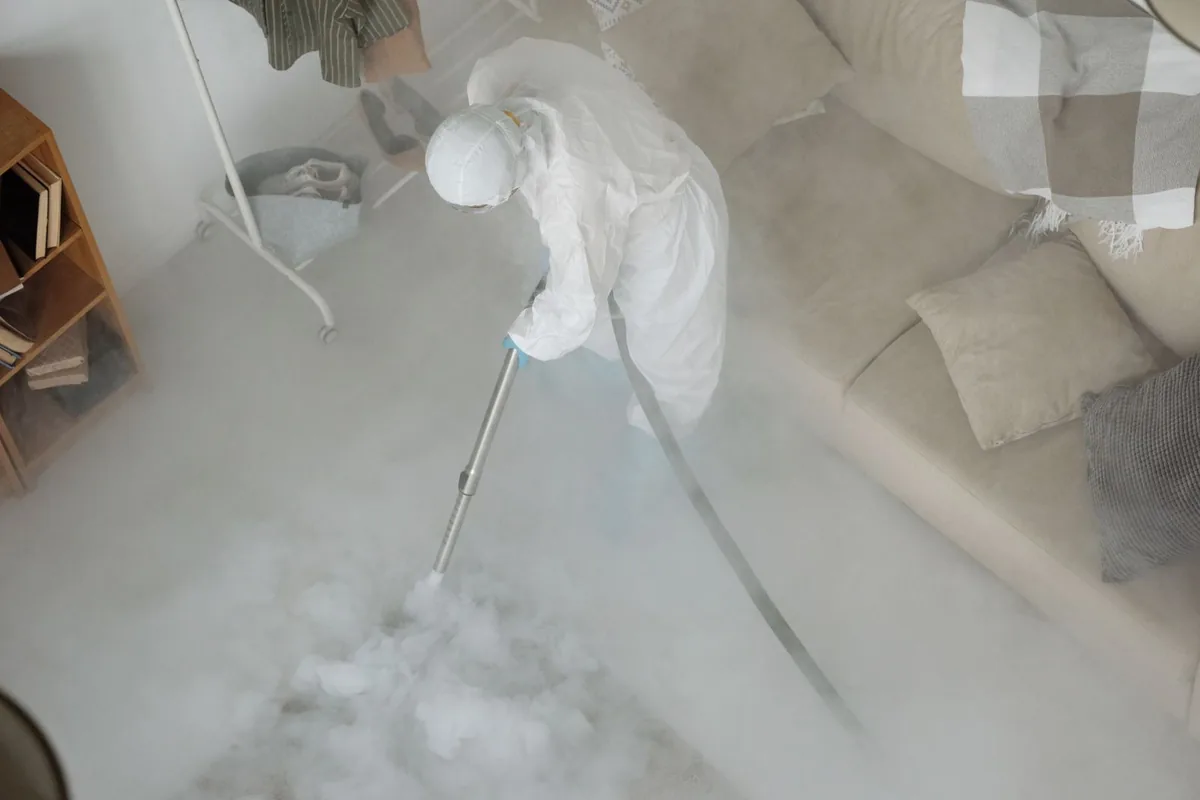 Biohazard cleanup technician in protective equipment, Summit Hill, St. Paul, MN